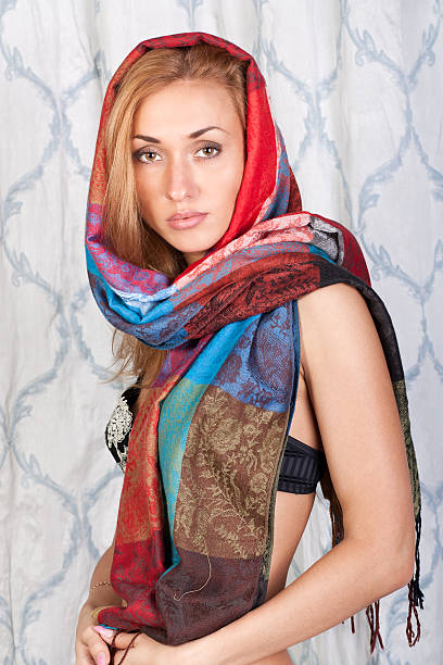 istock Stylish young lady in a colorful scarf 134132476