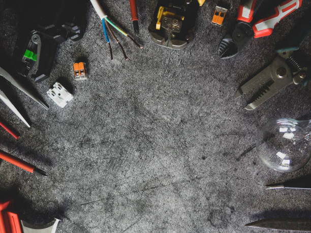 istock Flat lay composition with electrician's tools and space for text on gray concrete background 1341326353