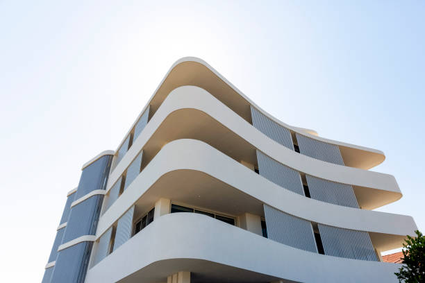istock Low angle view of new, modern apartment building, sky background with copy space 1341326800