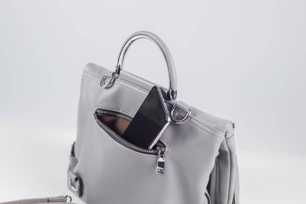 istock smartphone in open pocket of bag on white background 1341327865