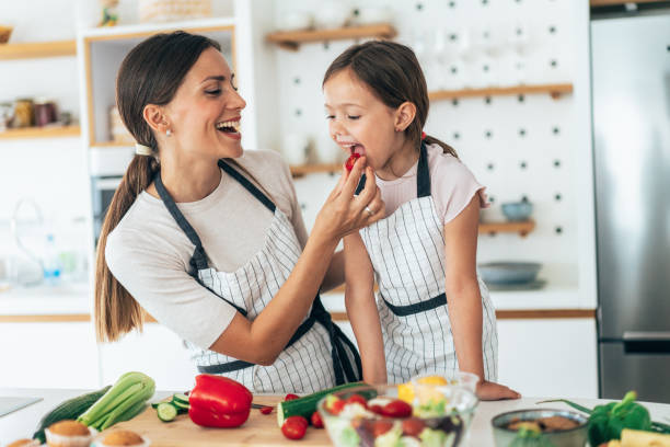 istock Mother and daughter in the kitchen 1341328670