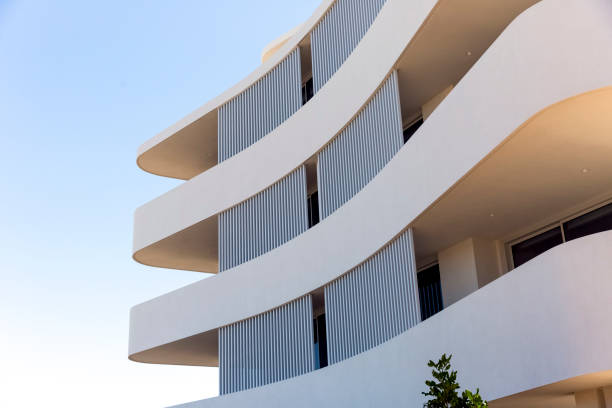 istock Closeup new, modern apartment building, sky background with copy space 1341328997