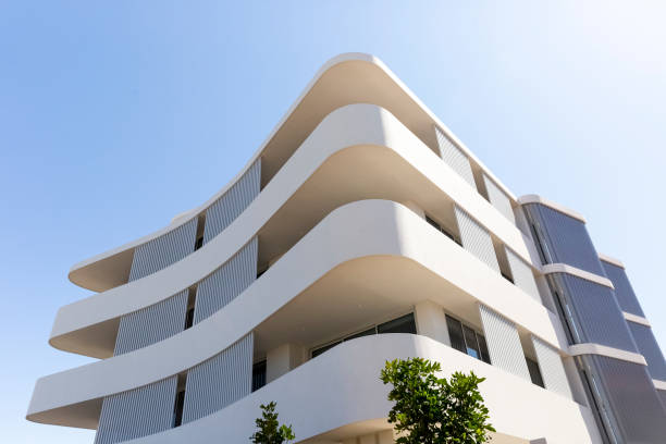 istock Low angle view of new, modern apartment building, sky background with copy space 1341331012