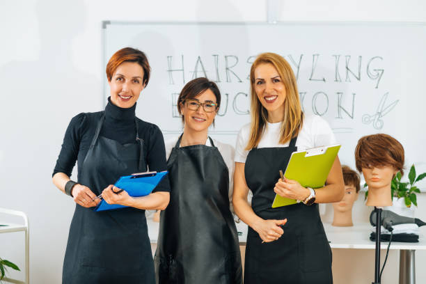istock Professional Hairdresser with Students 1341333535