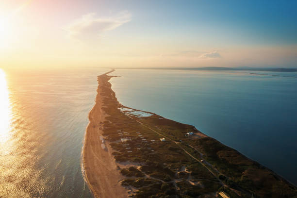 istock Long spit with beautiful sandy beach between sea and liman , aerial view from drone 1341334965