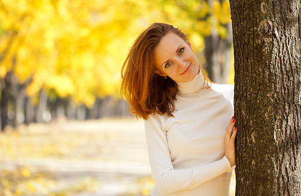 istock Young woman in autumn park 134133900