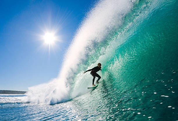 Surfer Surfer on perfect wave in the barrel surfing stock pictures, royalty-free photos & images