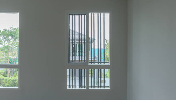 istock Glass window frame house interior on white wall 1341347176