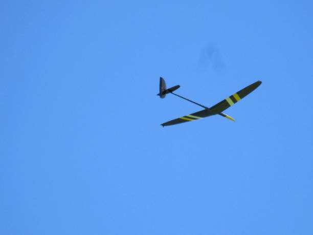 istock A glider flying high in the clear sky of Aso 1341348337