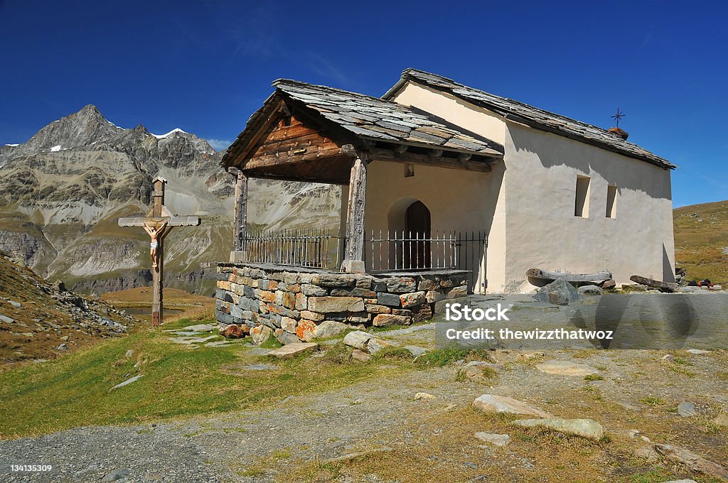chapel in the mountains small but charming chapel in the mountains above Zermatt in the swiss alps.  In the background the obergabelhorn Built Structure Stock Photo