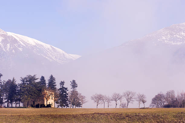 Italian countryside with fog stock photo