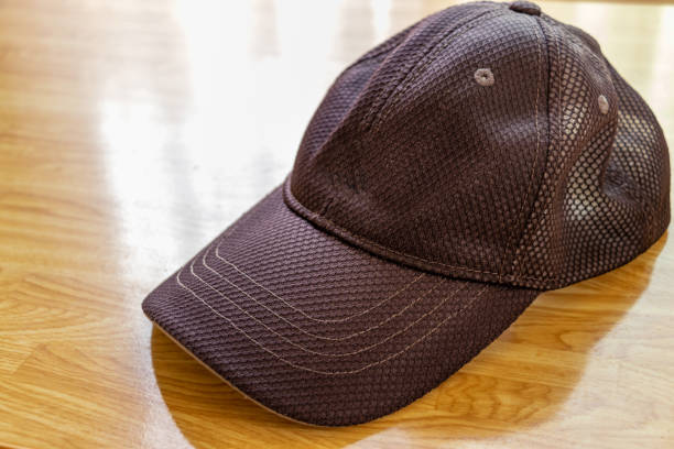 istock Black cap on the table by the window 1341355617