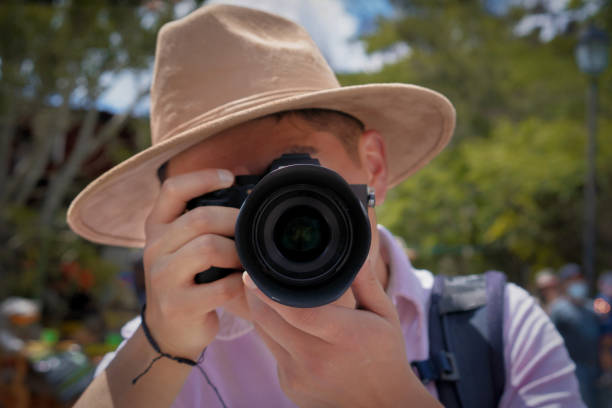 istock Young latin tourist taking a picture 1341356167
