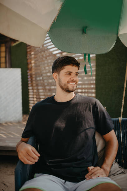 istock young man portrait on the beach 1341358987