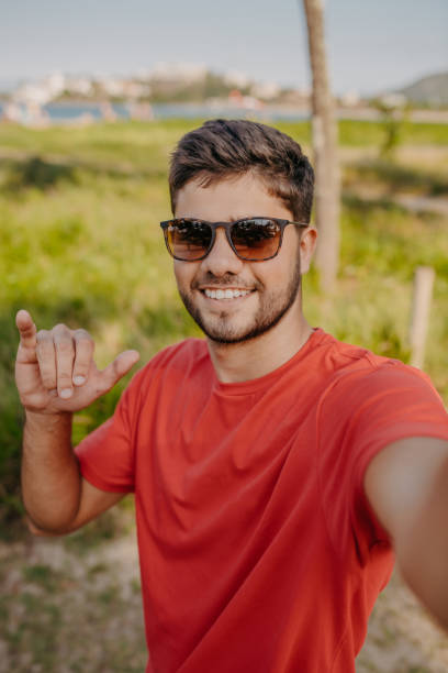 istock young man portrait on the beach 1341359097