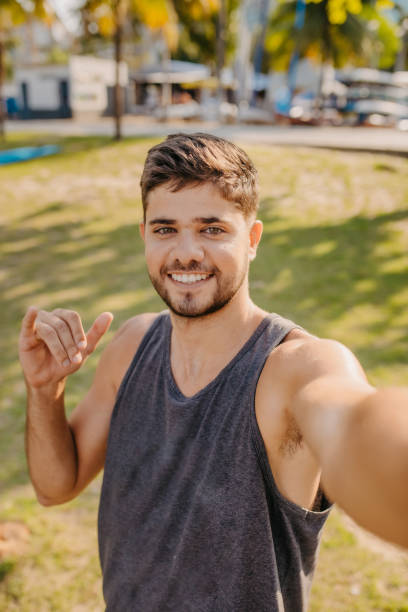 istock young man portrait on the beach 1341359179