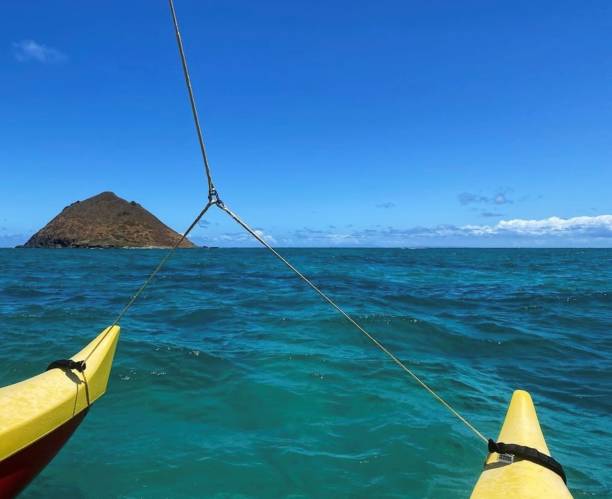 Canoe View of Oahu Floating in an outrigger canoe off the coast of Oahu, Hawaii. outrigger stock pictures, royalty-free photos & images
