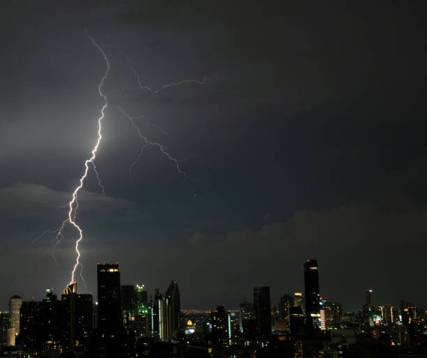 istock Lightning storm over a large city 1341362164