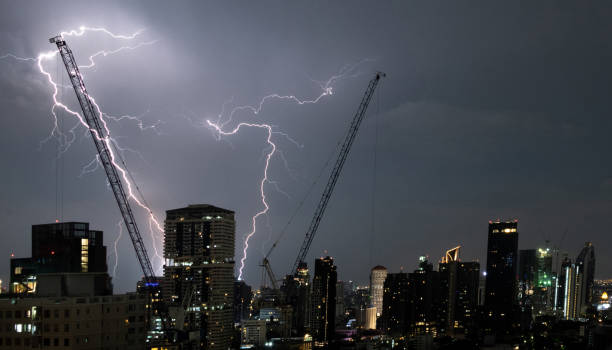 istock Lightning strike at a construction site in a large city 1341362165