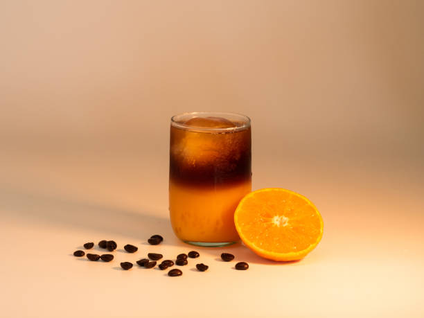 orange americano kaffee - cocktail orange cup juice stock-fotos und bilder