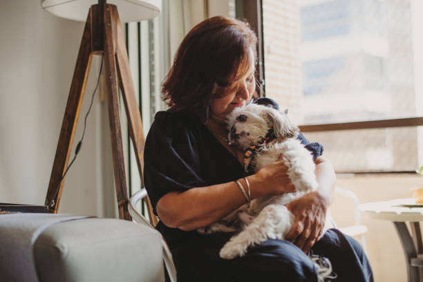 istock old woman at home with her dog 1341363988