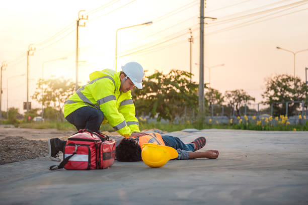 istock Accident at work of construction labor people, Basic First aid and CPR Training at outdoor. Heat Stroke or Heat exhaustion in body concept. 1341371299