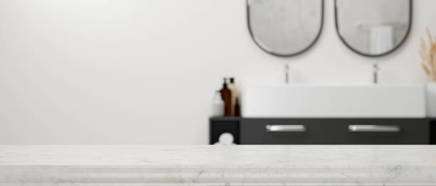 istock Empty marble tabletop with space for montage over blurry modern stylish bathroom interior 1341371615