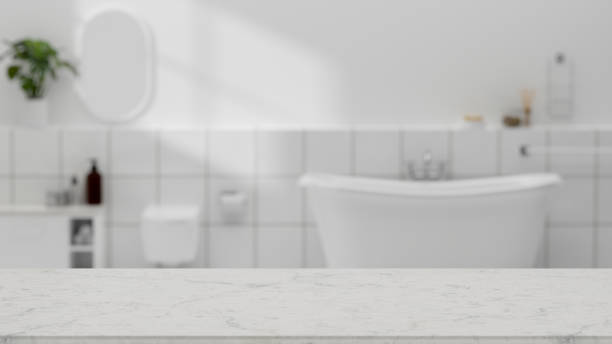 istock Copy space on marble bathroom tabletop over modern white bathroom interior 1341371622