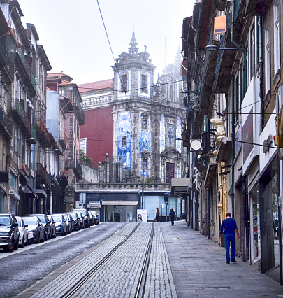Porto, Portugal - 29 Sept, 2019: Early morning walking street to Church Santo Ildefonso past traditional Portuguese Buildings On Rua de 31 de Janeiro Porto, Portugal