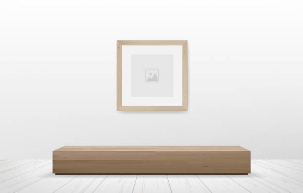 istock Picture frame and wooden bench in white room space background. 1341374759