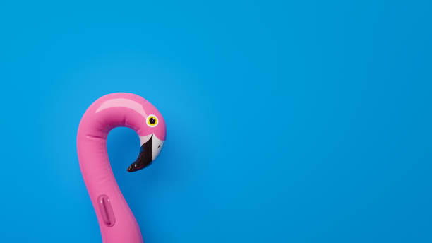 istock Giant inflatable Flamingo on a blue background with copy space. 3d-Illustration 1341375011