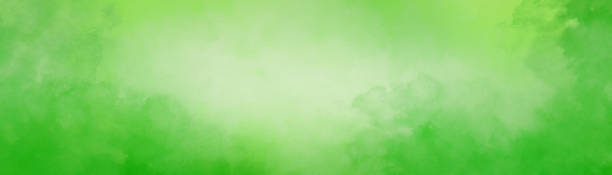 green watercolor background with texture and abstract white center and cloudy painted border design stock photo