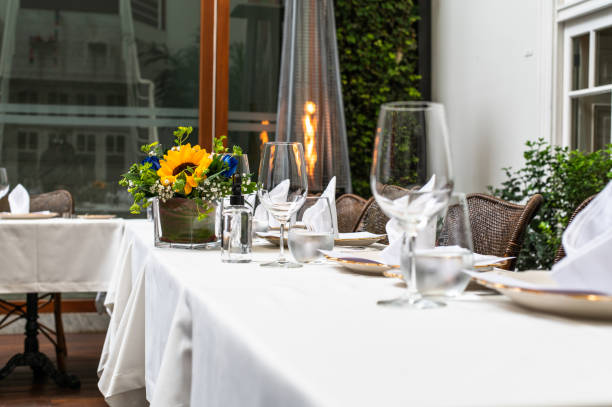 istock Elegant wedding lunch table decorated with crystal goblets and yellow flowers. 1341377227