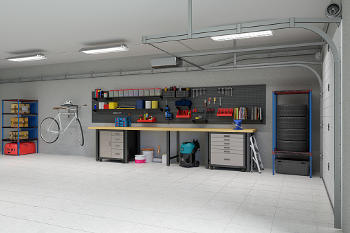 Empty Garage With Working Equipments, Tools And Bicycle Hanging On The Wall.