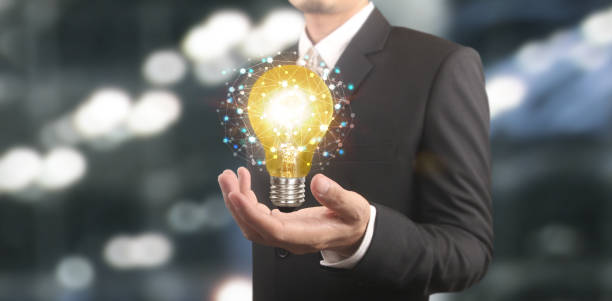 istock Hand of holding illuminated light bulb,  innovation inspiration concept 1341380424