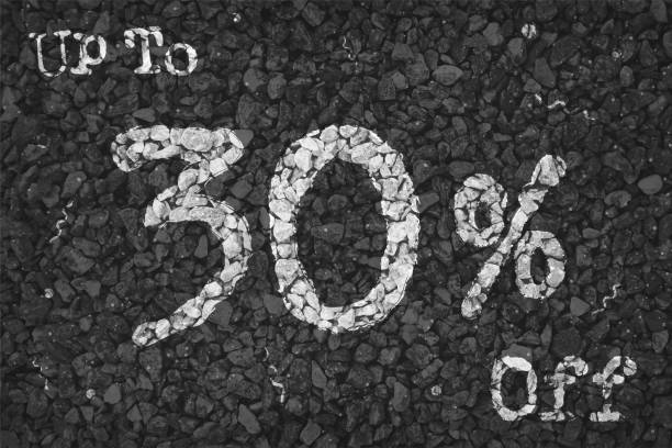 istock Black and white coloured pebbles making a rustic poster with text Up to 30 % Off painted on gravel road pattern, for  clearance up to thirty percent SALE related vector backgrounds 1341380769