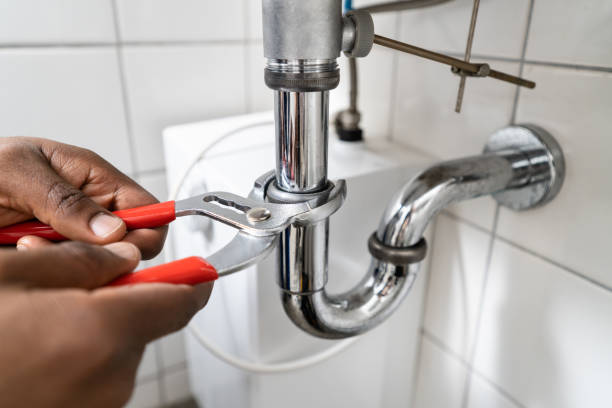 istock Photo Of Plumber Fixing A Sink 1341381764