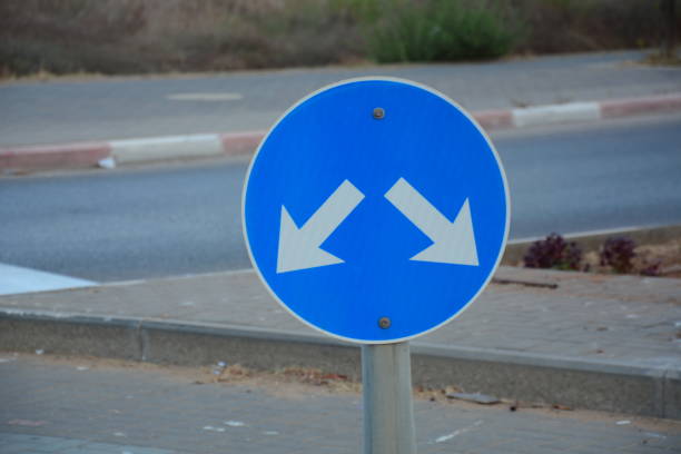 istock Traffic direction sign 'Pass either side'. Pass designated place on right or left sign. 1341383186