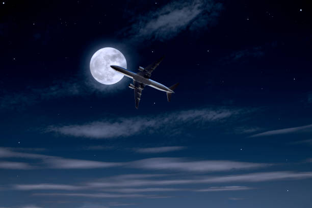 istock Airplane passing the full moon 1341385081