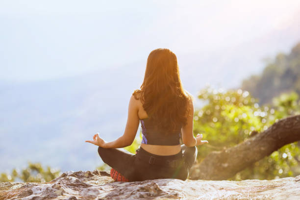 istock Young woman preforms yoga 1341387907