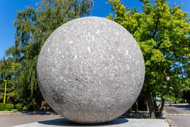 Large granite ball on the territory of Moscow State University (MSU) on Sparrow Hills (summer day).Russia