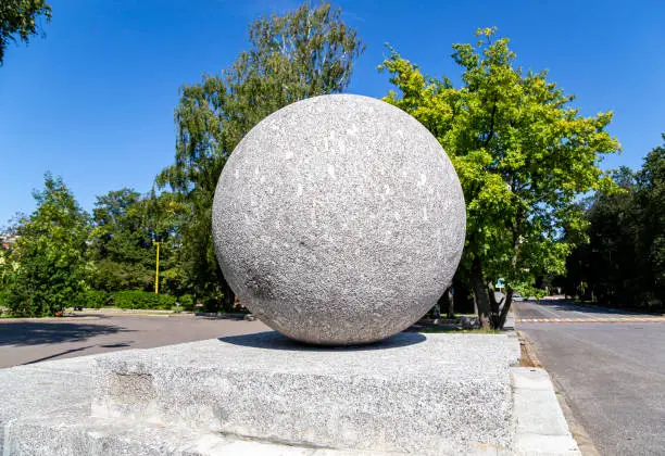 Large granite ball on the territory of Moscow State University (MSU) on Sparrow Hills (summer day).Russia