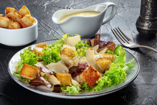 istock Chicken Caesar salad with the classic dressing, croutons, and pepper 1341389241