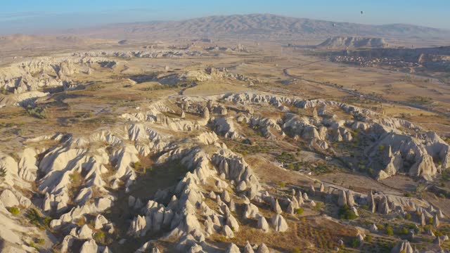 Cappadocia aerial drone view sandy volcanic formations and ancient caves. Goreme, Kayseri, Cappadocia, Turkey - 2020. Aerial view 4K.