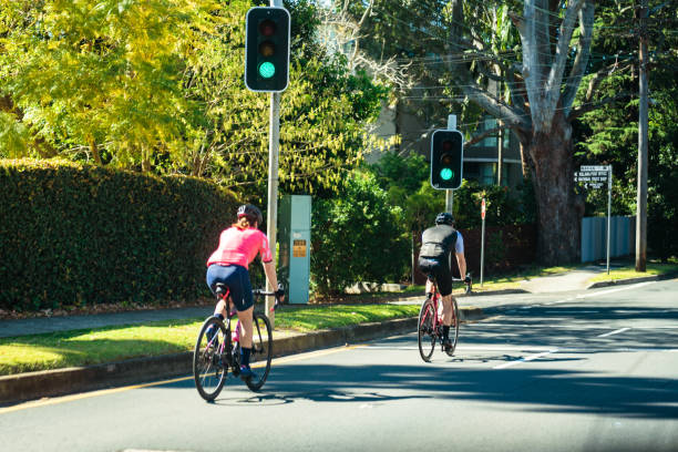 Two cyclist riding on the road Sydney, Australia, 19 September 2021- Couple of cyclists riding on Pacific Highway, Chatswood. Cycling stock pictures, royalty-free photos & images