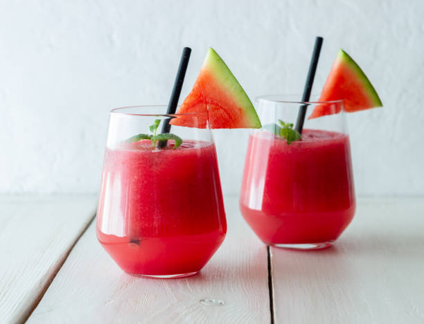 Watermelon drink with mint and ice. Cold drinks. Summer. Healthy eating. Vegetarian food. Watermelon drink with mint and ice. Cold drinks. Summer. Healthy eating. Vegetarian food watermelon juice stock pictures, royalty-free photos & images