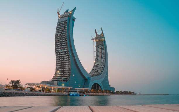 Lusail, the waterfront of the new developing city in Qatar Lusail,Qatar - September 3,2021: the newly build crescent tower during sunset. dhow photos stock pictures, royalty-free photos & images