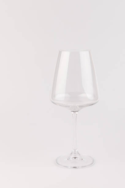 istock Empty transparent wine glass on the white background 1341396038