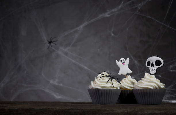 istock scary halloween cupcakes on a dark background with cobwebs 1341396151