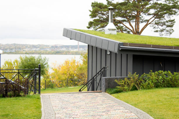 istock Eco roof, a low building with grass on the roof 1341396876